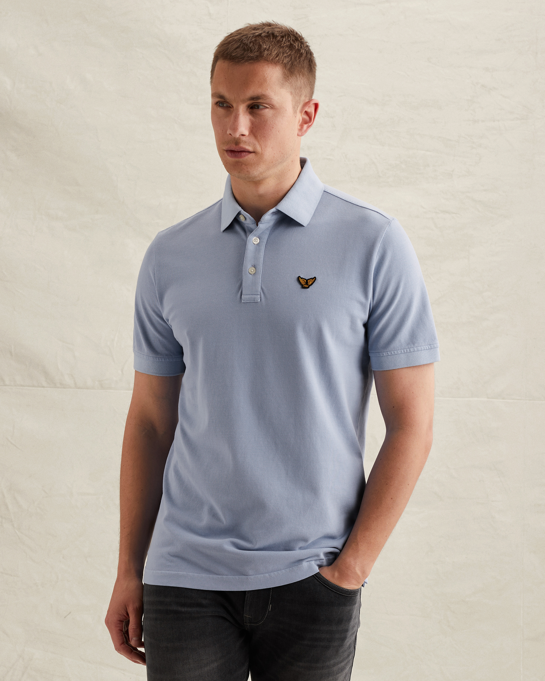 Polo shirt with tailwing logo and garment-dye washx