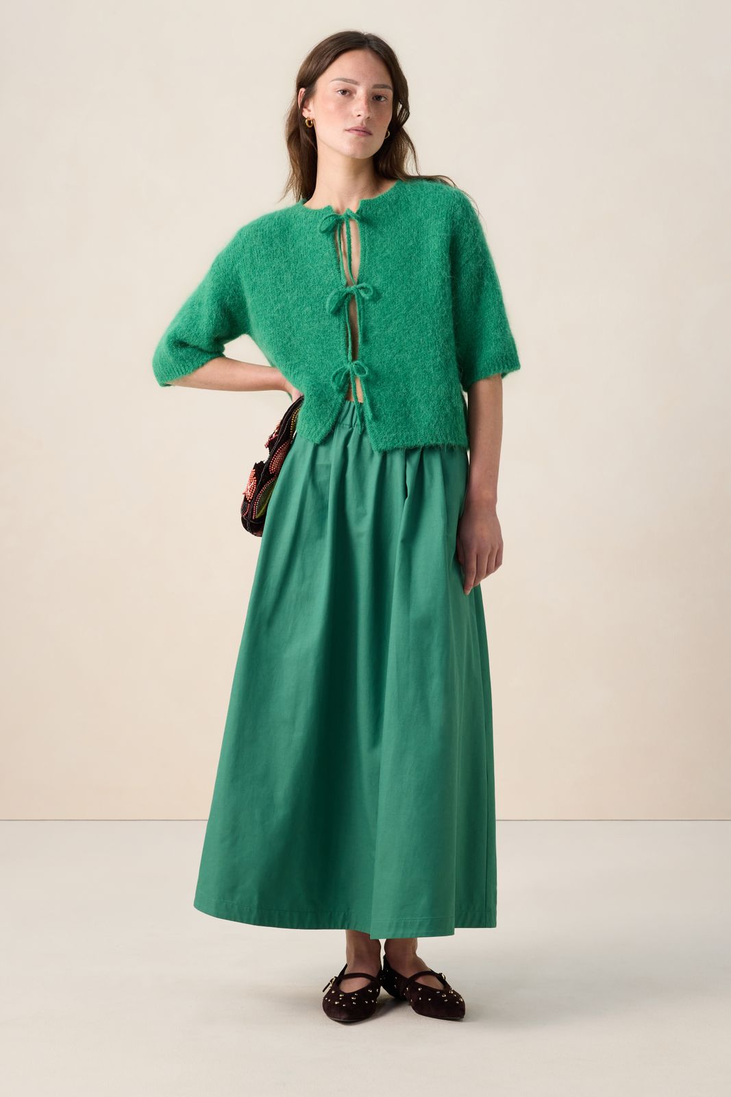 Groen wollen vest met strikjes