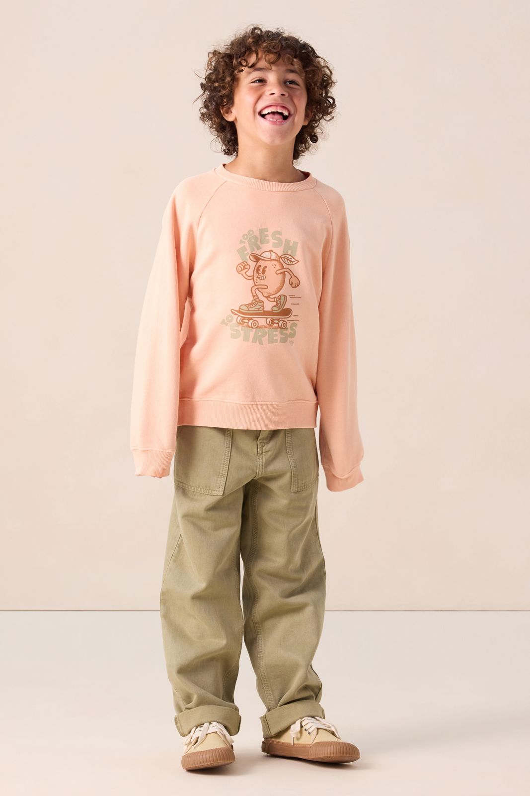 Lichtoranje sweater met print