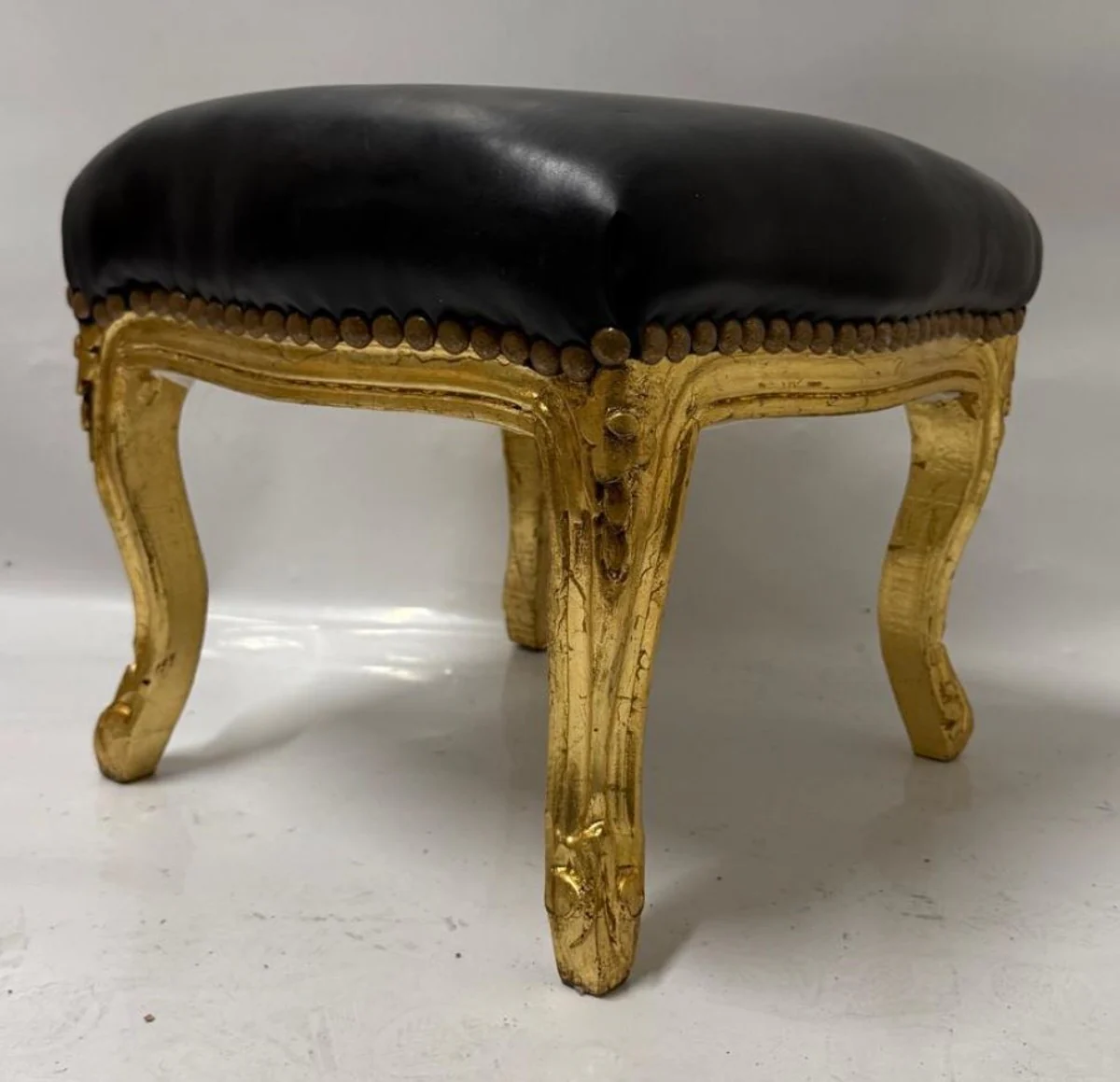 Baroque faux leather footstool black / antique gold H. 34 cm - baroque style stool