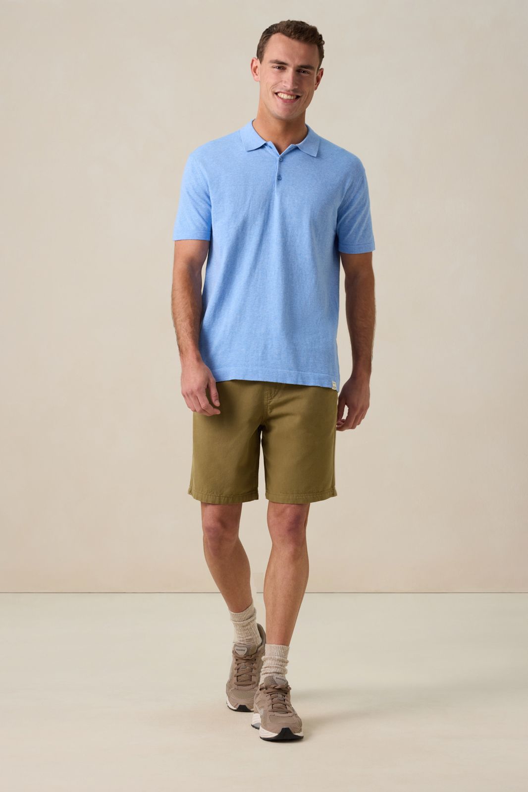 Blauwe gebreide polo