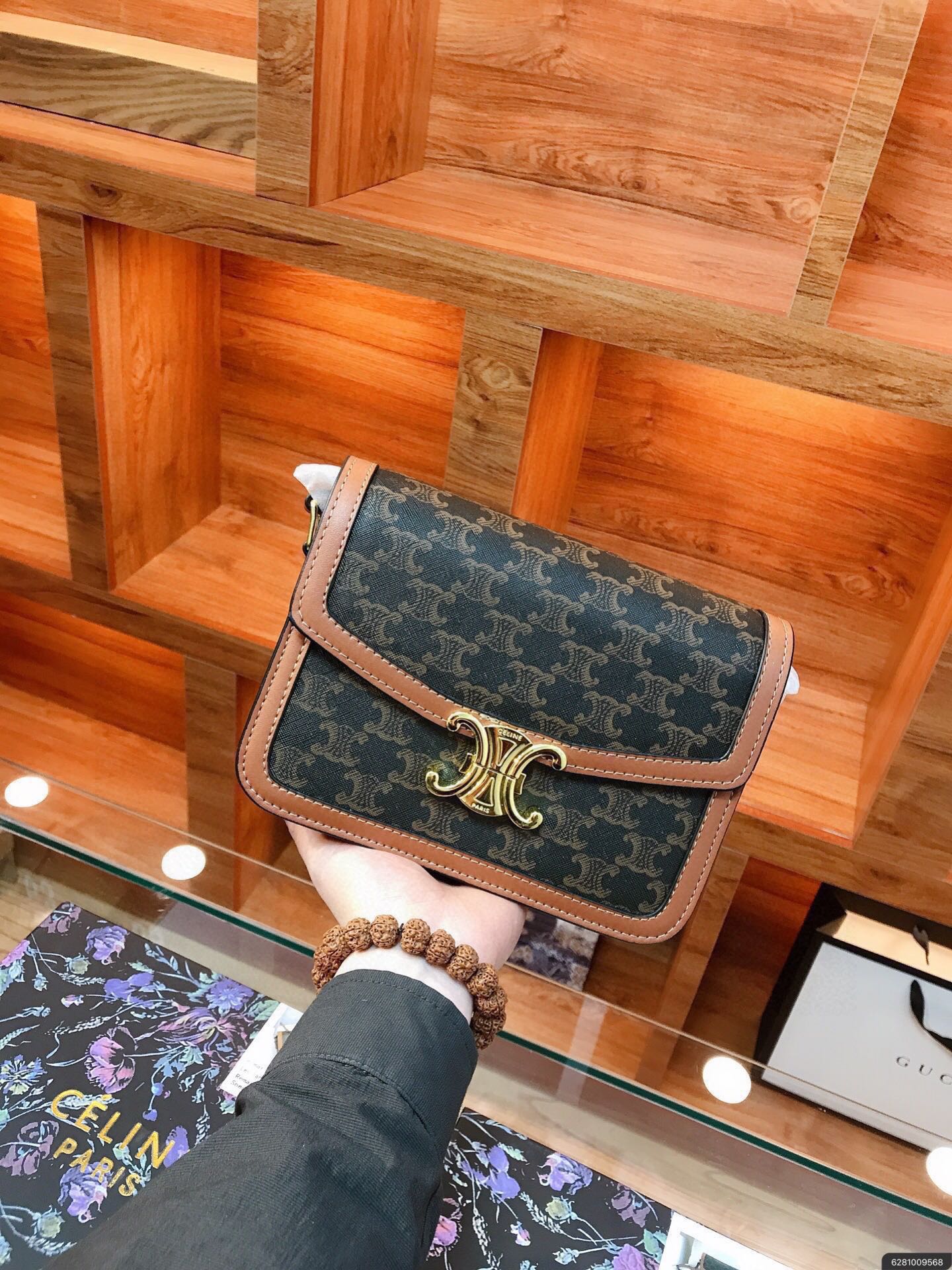 CLASSIQUE TRIOMPHE BAG IN TRIOMPHE CANVAS AND CALFSKIN TAN