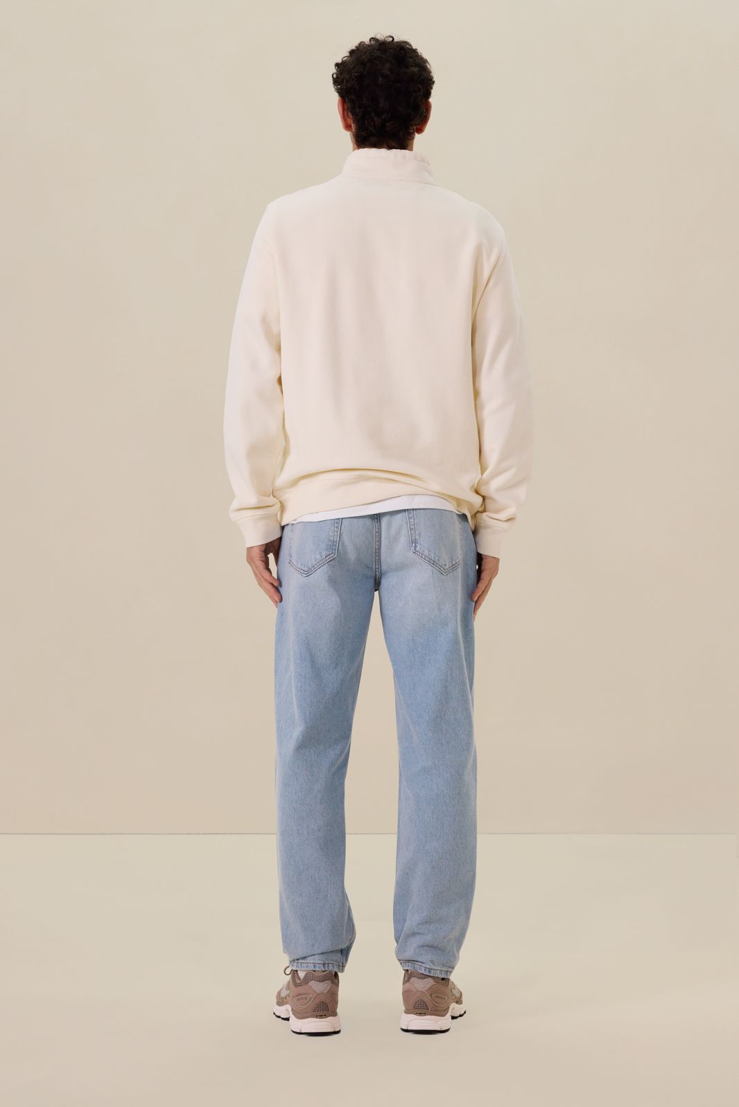 Witte sweater met rits en artwork