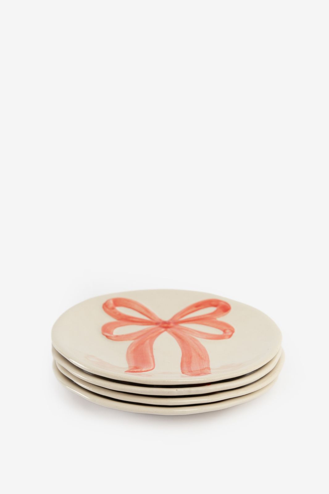 Beige dessertbord met roze strik