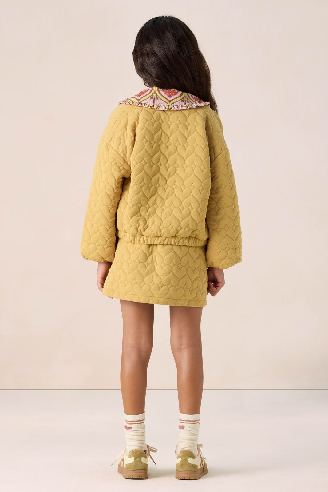 Gele quilted jas met hartjes