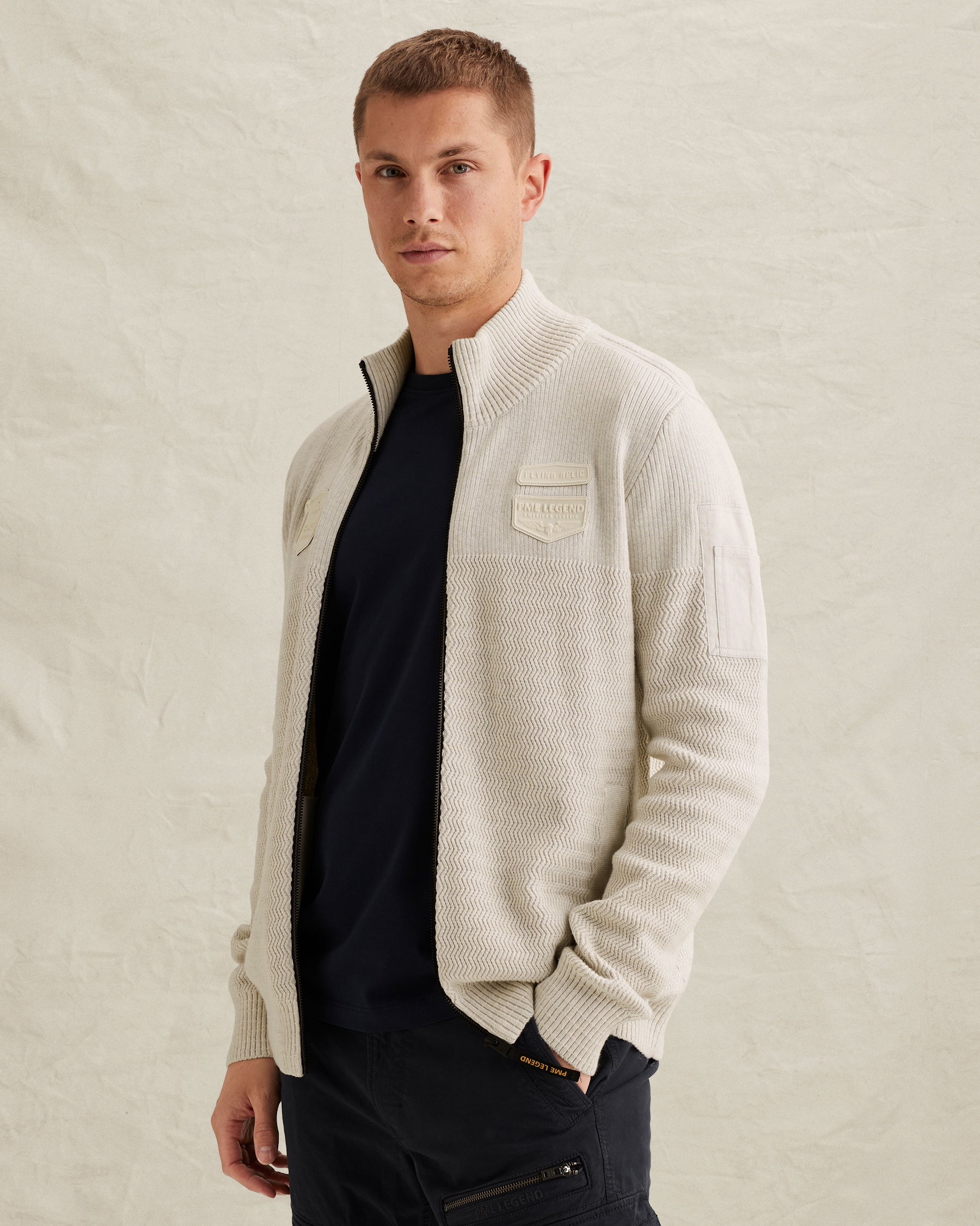 Cardigan with zipper closure and flight pocketx