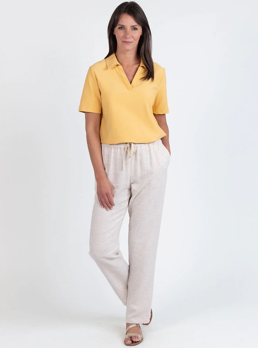 Polo femme en maille de coton jaune épicé