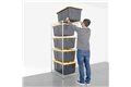 slide 2 of 10, zoom in, saferacks bin storage rack filled with costco's 27 gallon bins. a person is sliding a tote off of the top shelf.
