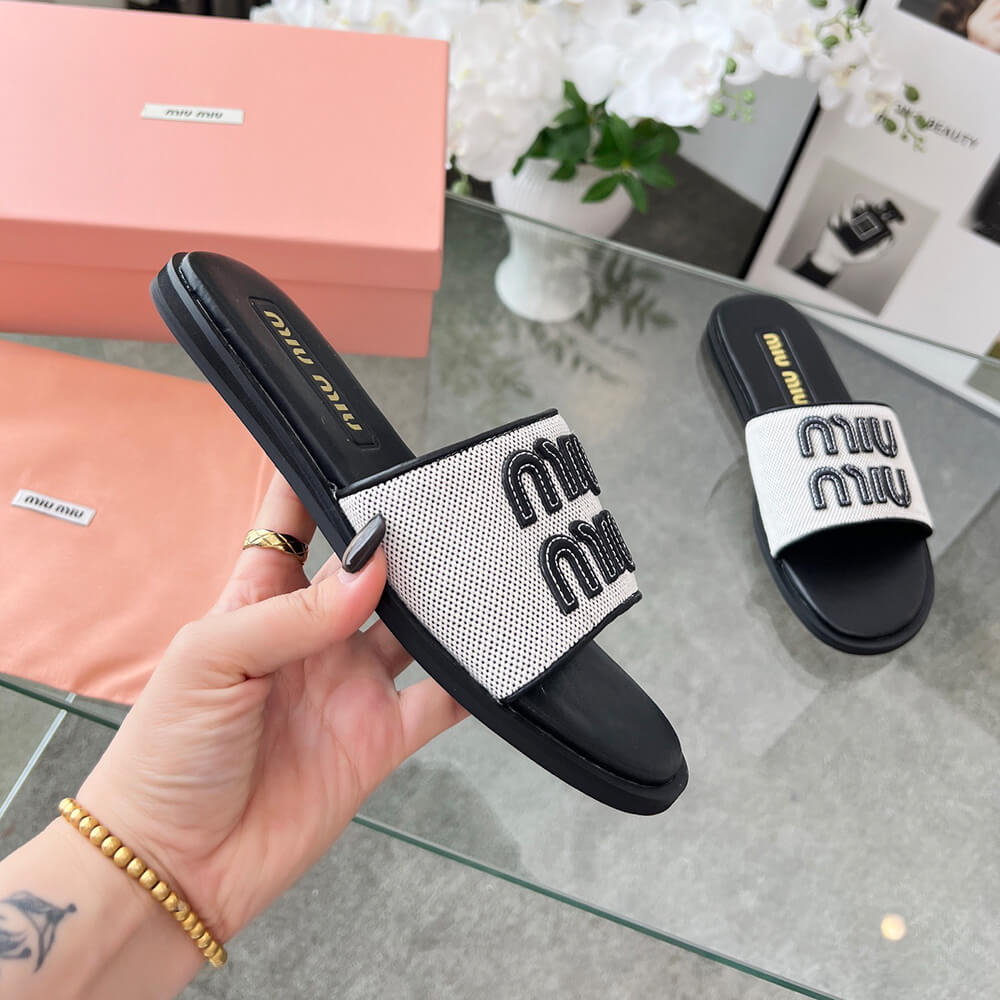 MiuMiu Canvas and leather slides - Top Club