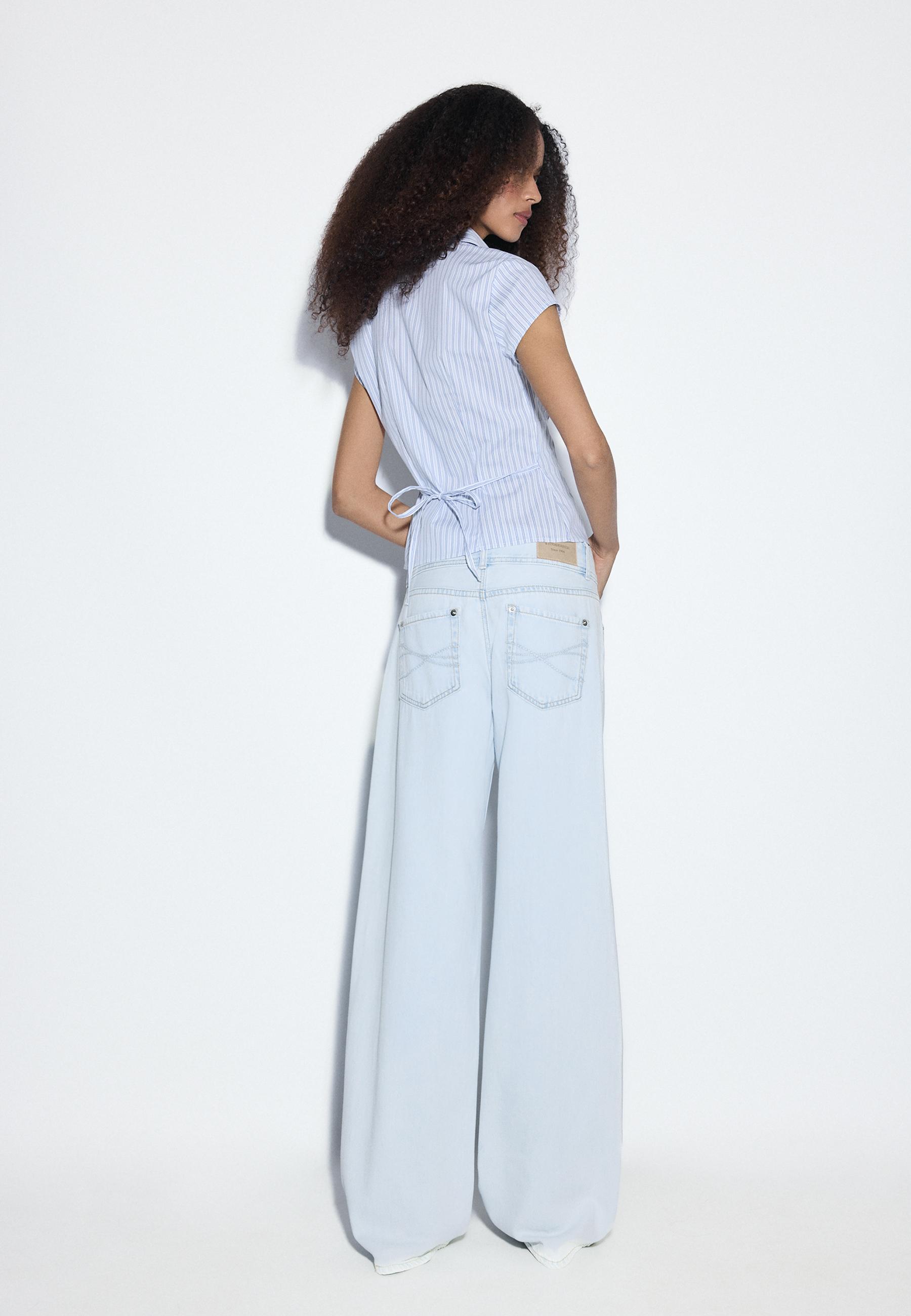 LOW-RISE DOUBLE-BUTTON JEANS