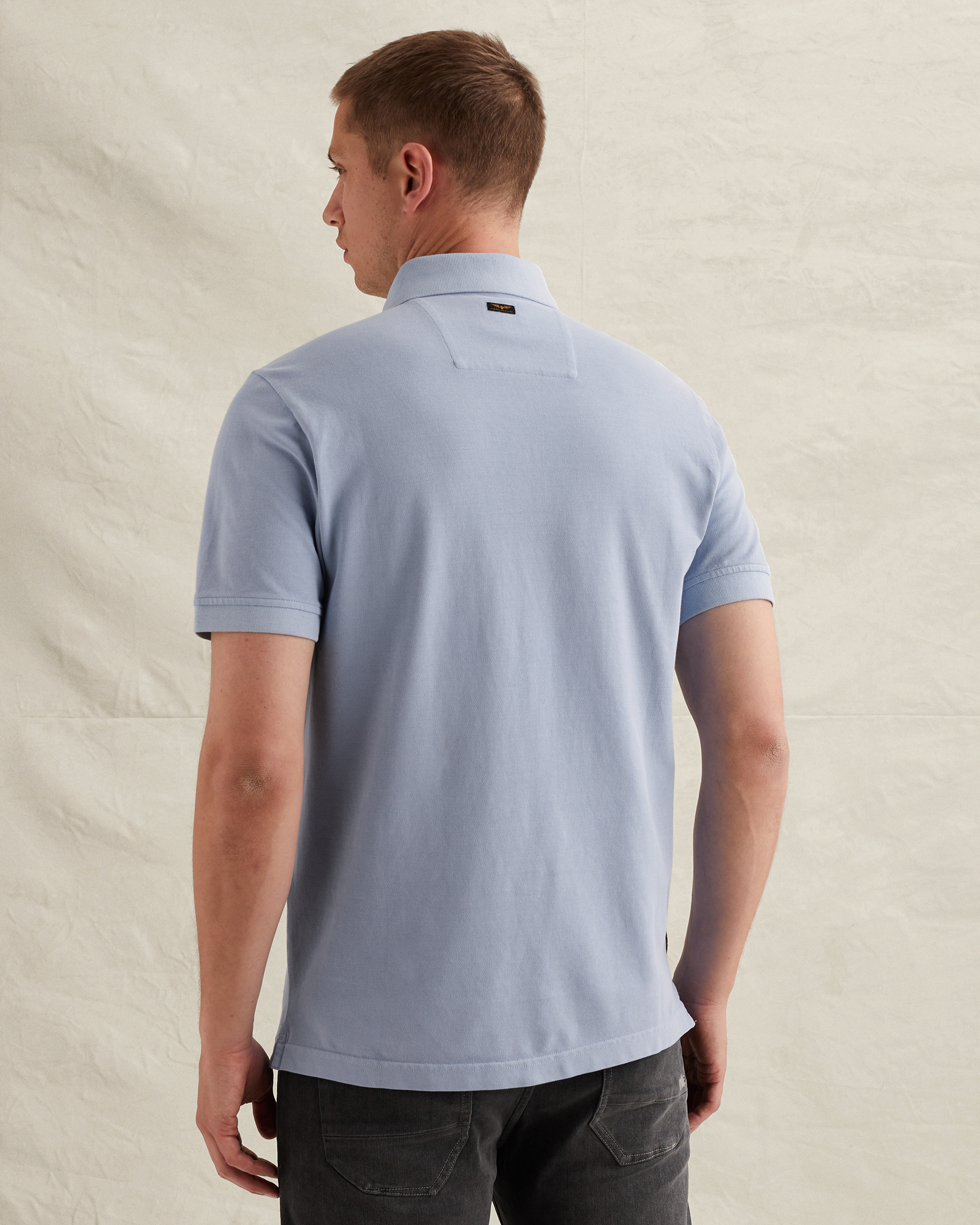 Polo shirt with tailwing logo and garment-dye washx