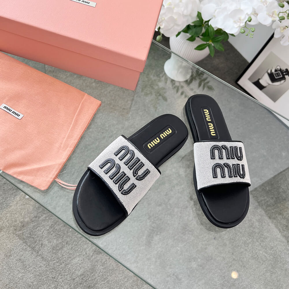 MiuMiu Canvas and leather slides - Top Club