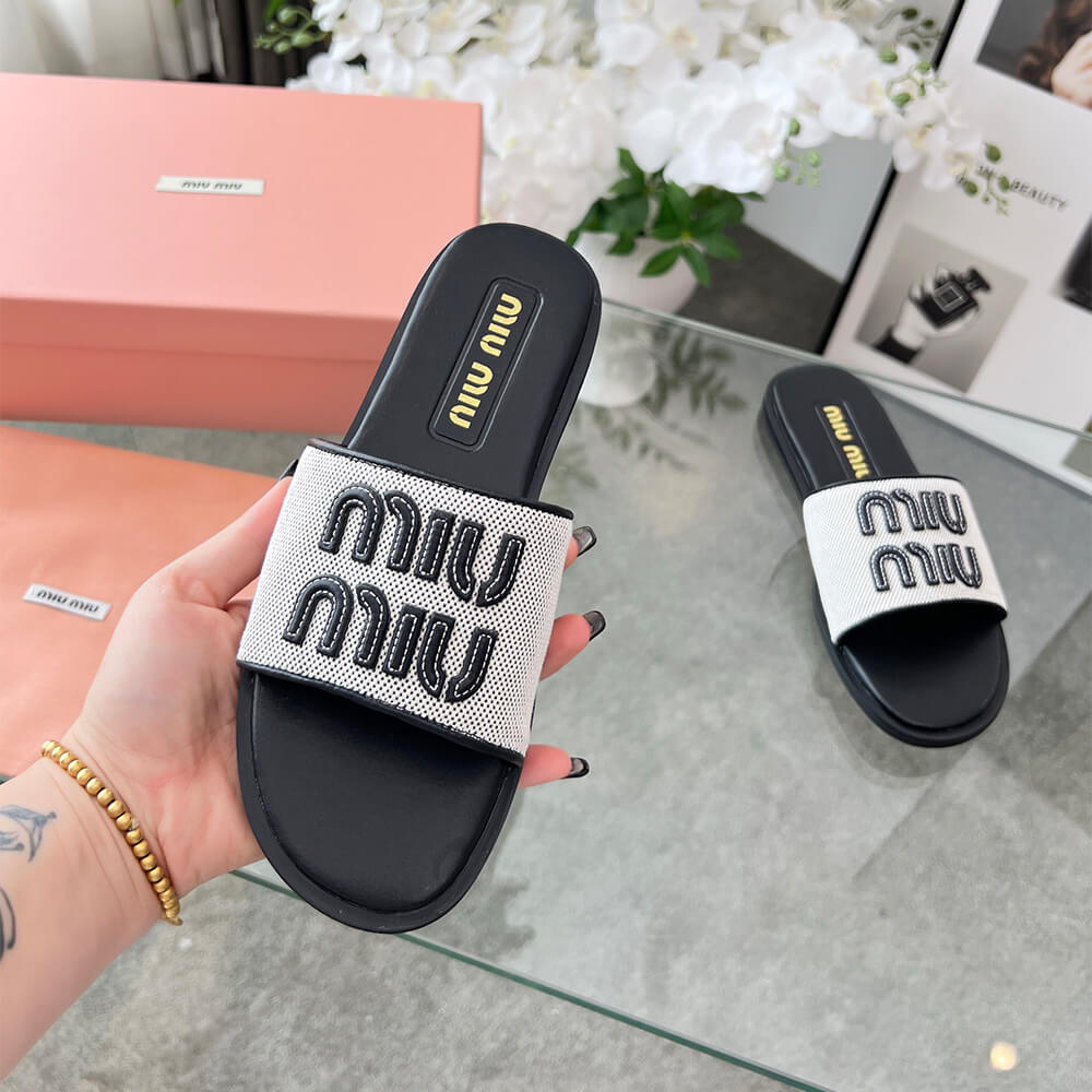 MiuMiu Canvas and leather slides - Top Club