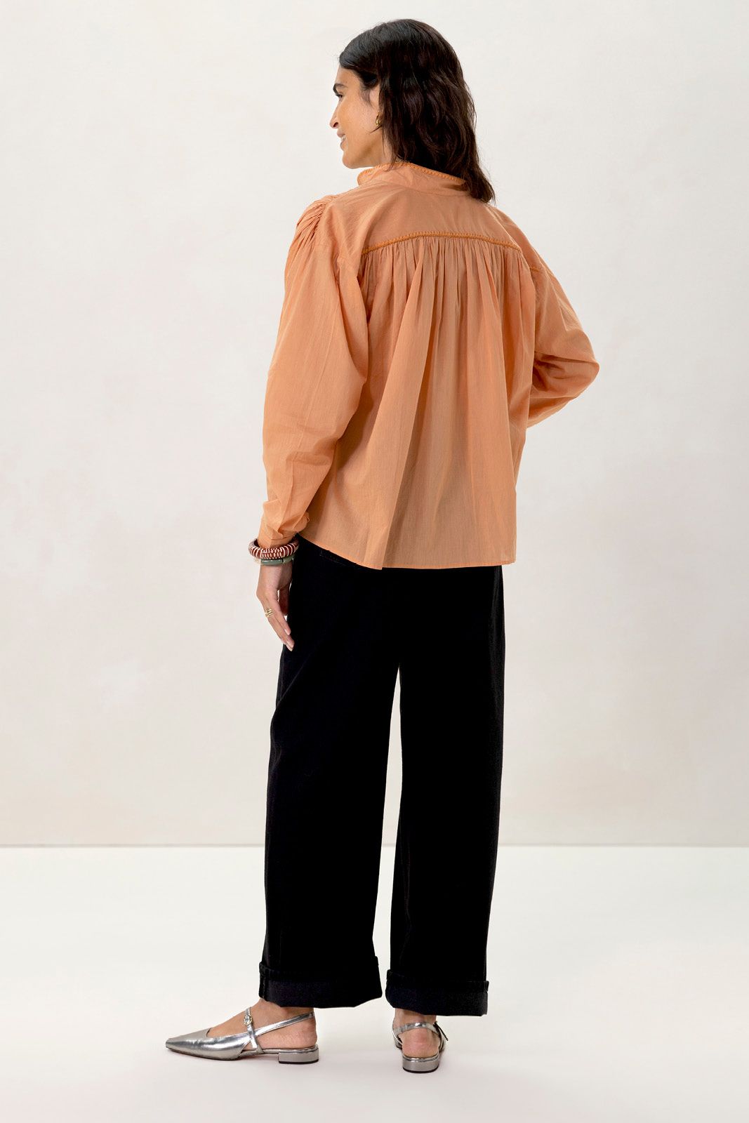 Oranje blouse met plooiing