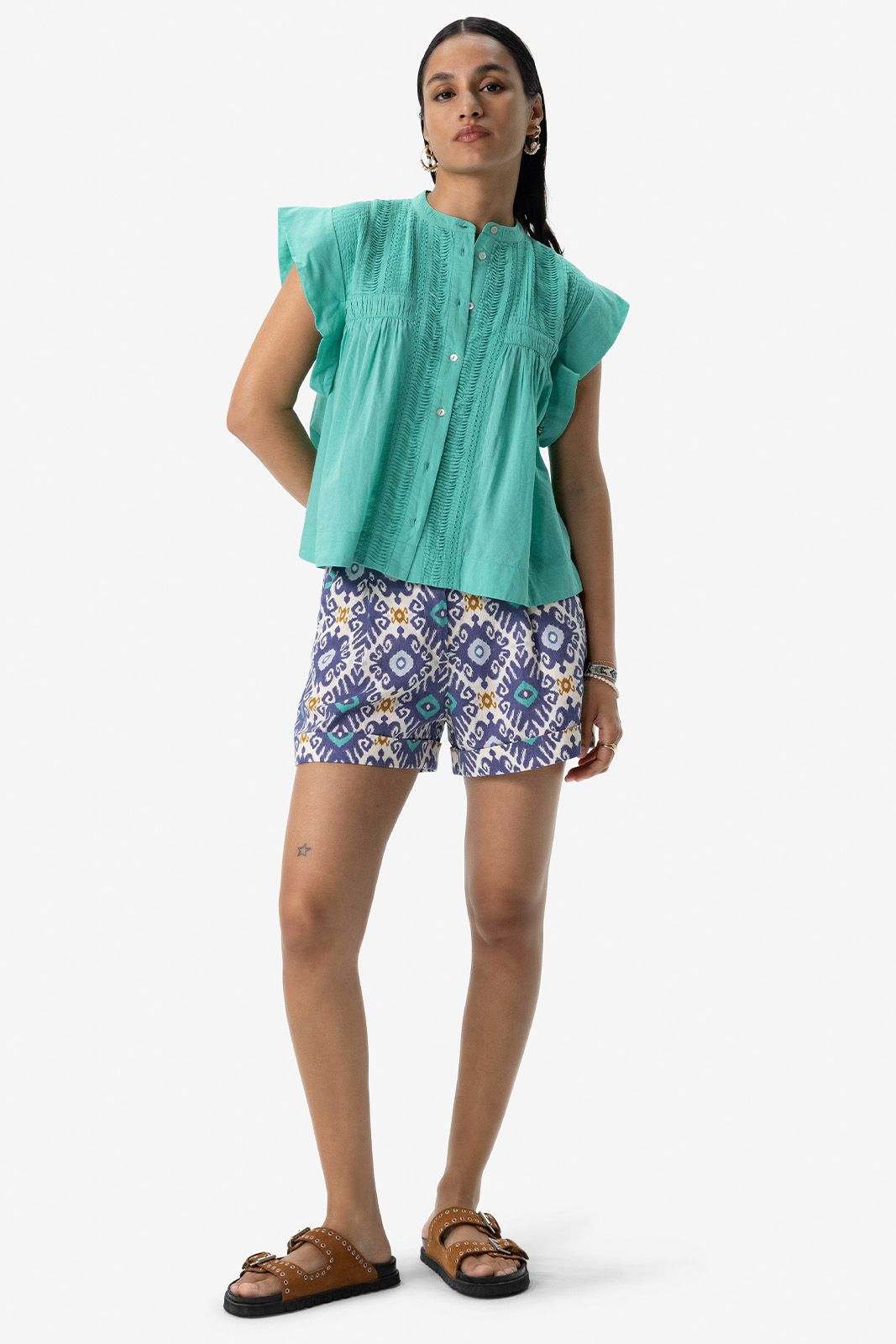 Turquoise mouwloze blouse met pintuck details