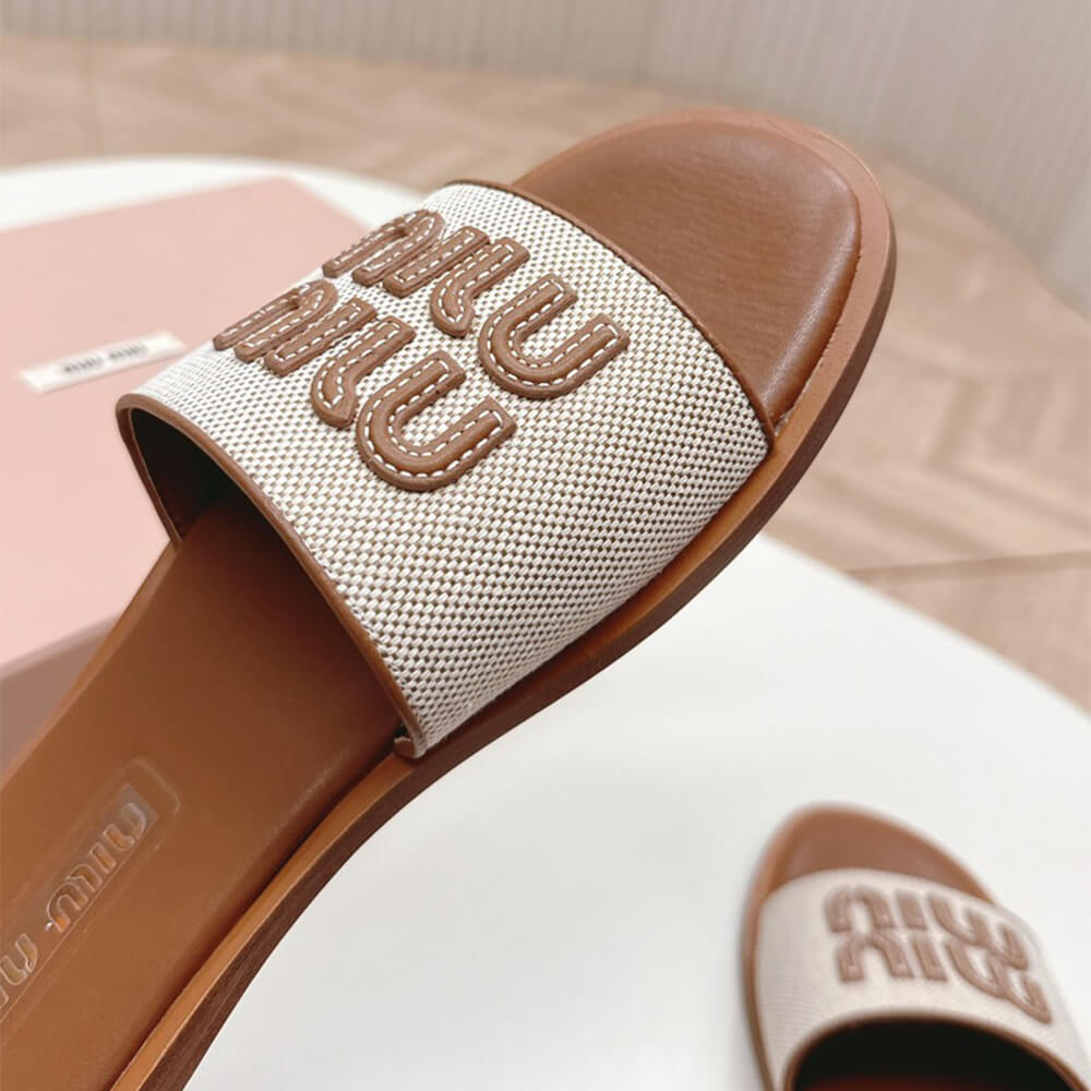 MiuMiu Canvas and leather slides - Top Club