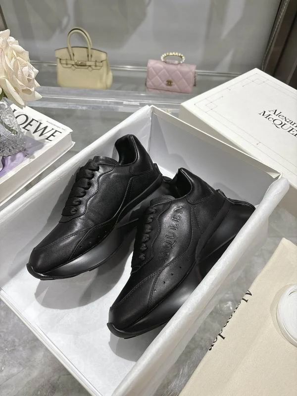 Sleek All Black Alexander McQueen Oversized Sneakers For Timeless Street Style - Sneaker Replica Workshop