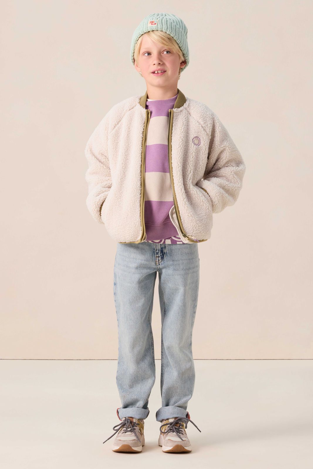 Witte teddy jas met smiley