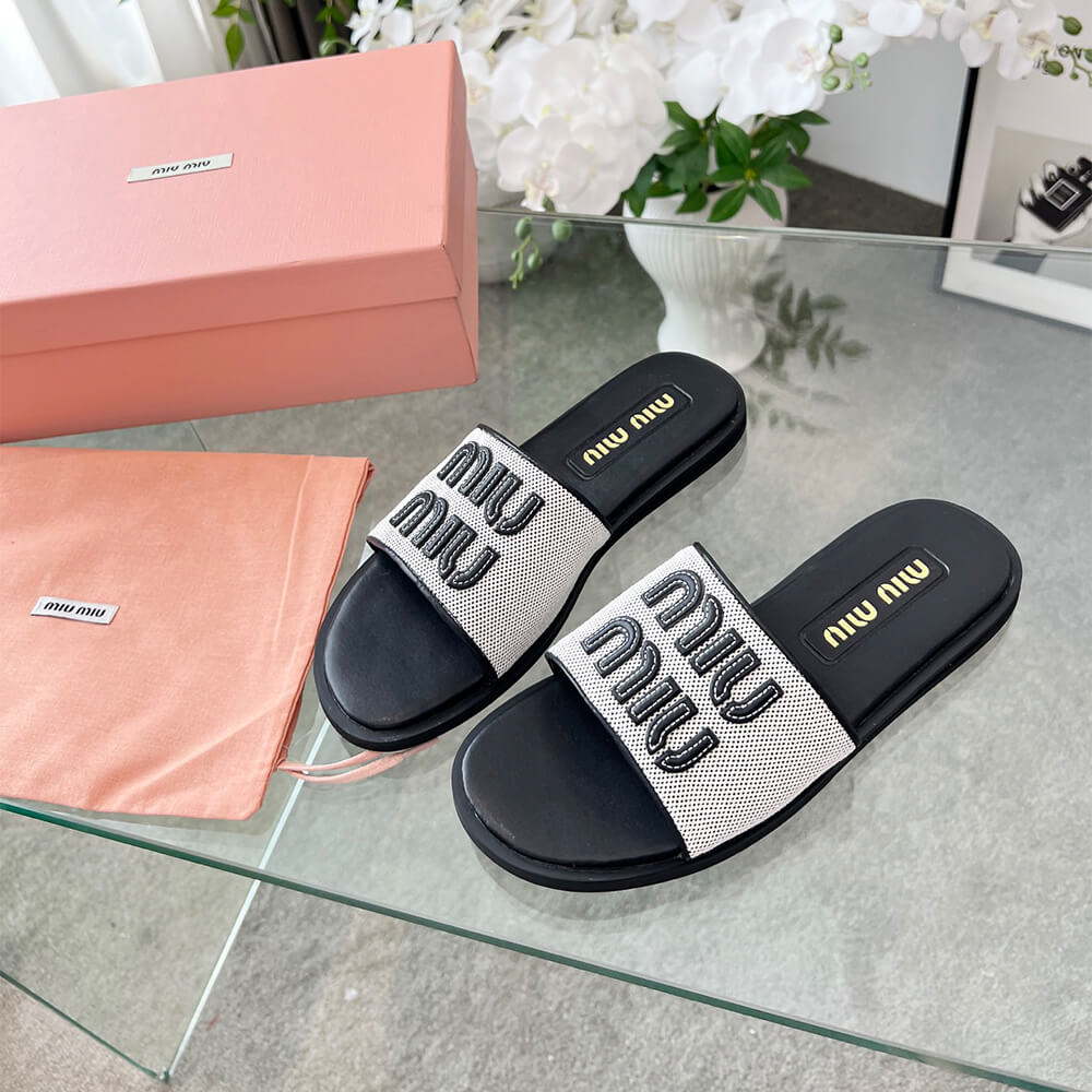 MiuMiu Canvas and leather slides - Top Club