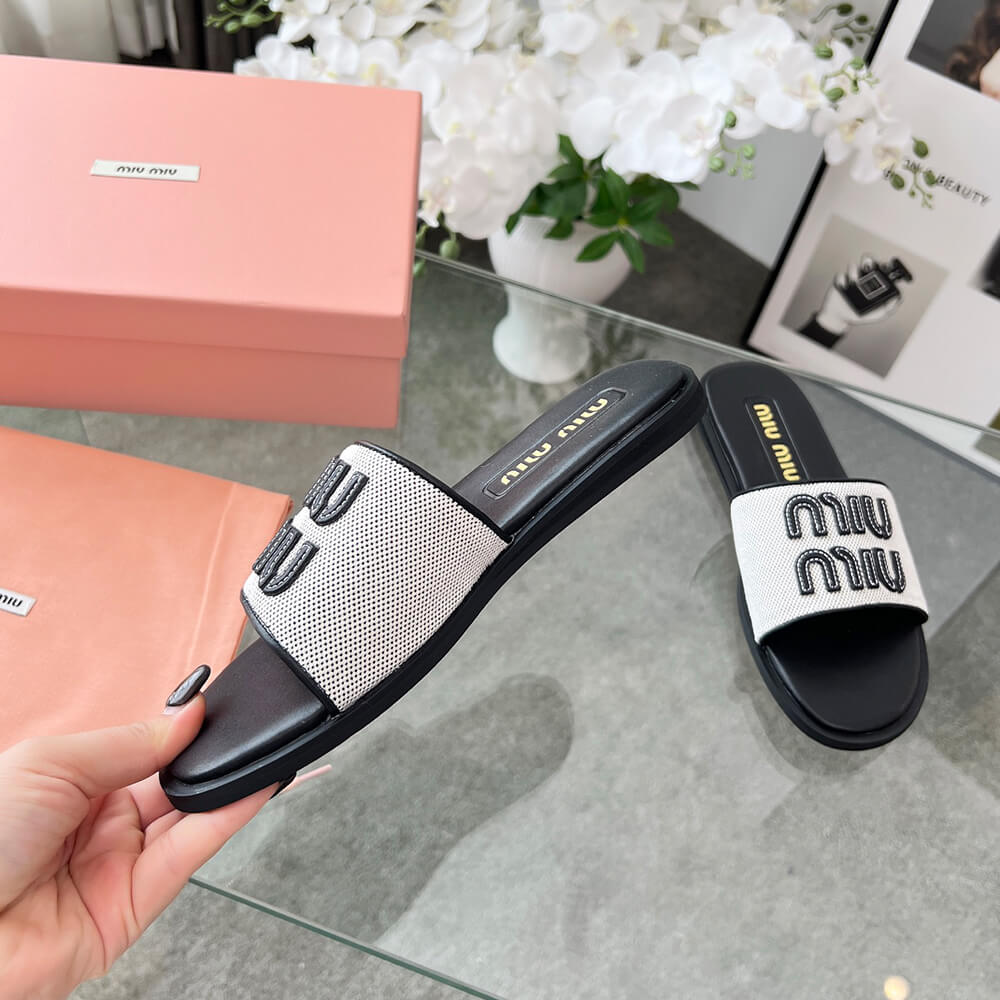 MiuMiu Canvas and leather slides - Top Club