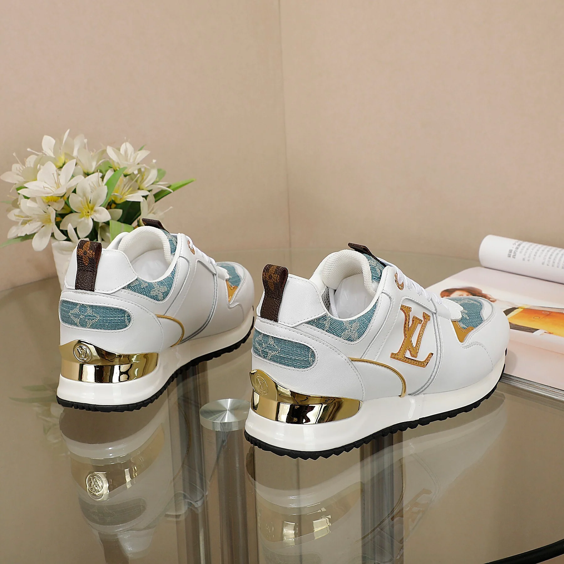 Louis Vuitton Women's White Sneakers With Blue Patterns And Gold Accents - Sneaker Replica Workshop