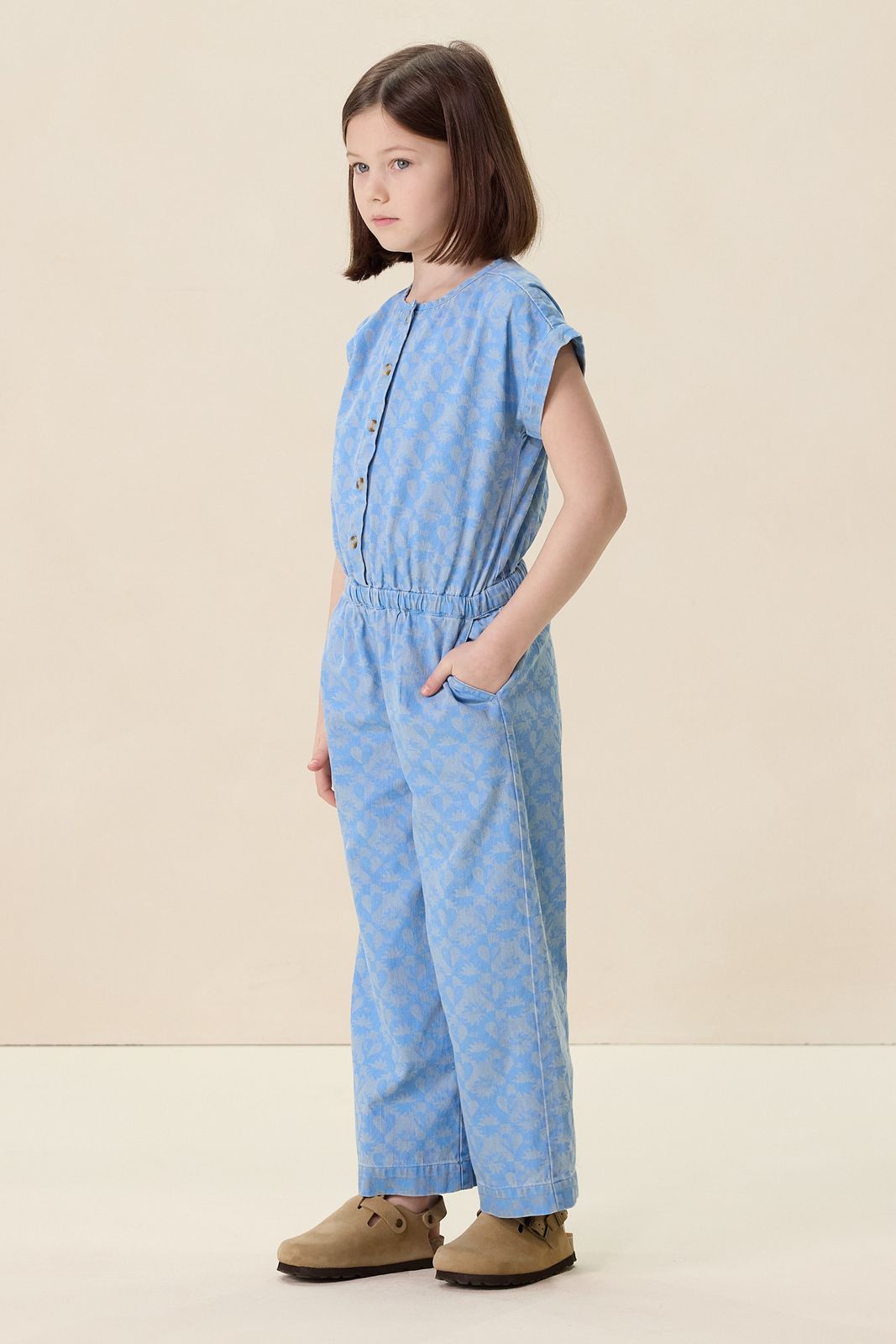 Blauwe denim jumpsuit met print