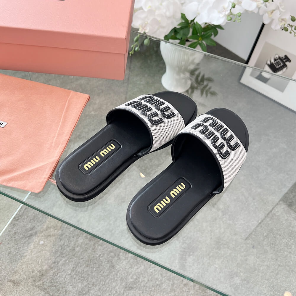 MiuMiu Canvas and leather slides - Top Club
