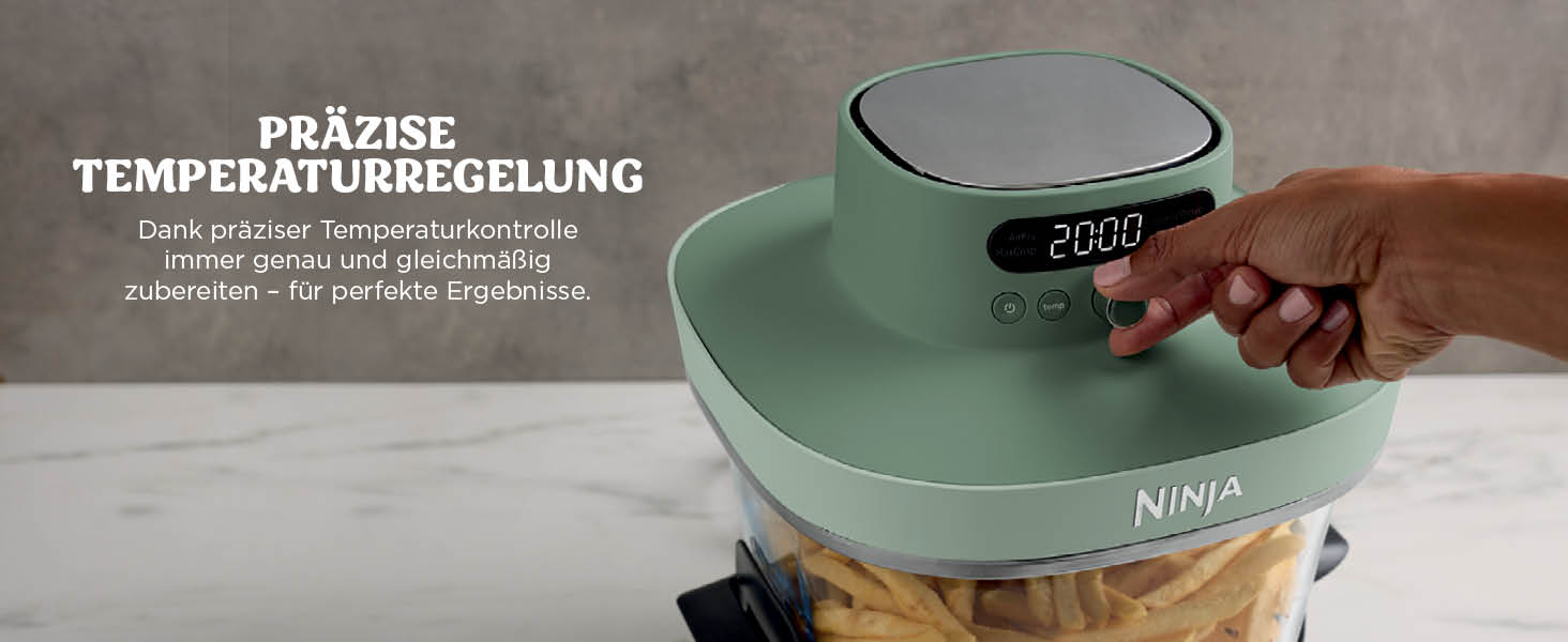 Der Text lautet „PRÄZISE TEMPERATURREGELUNG“. Mintgrüne Ninja Heißluftfritteuse mit Digitalanzeige, die „200D“ anzeigt. Von Hand einstellbare Temperaturkontrolle mit sichtbaren Pommes frites im Korb.